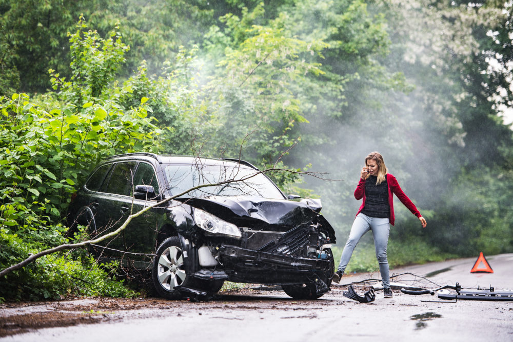 A woman experiences a car accident. The location of damage to the vehicle involved provides insights into the events that precipitated the crash.